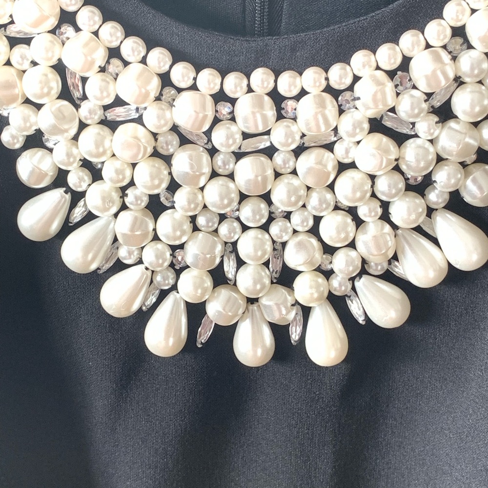 Little black dress with pearl embellished neck!
